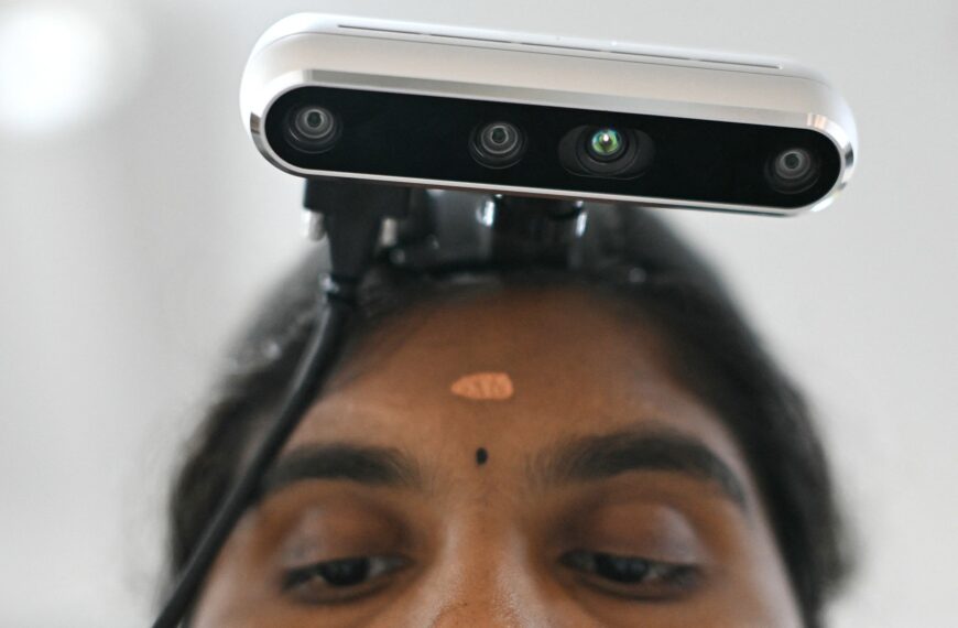 Factories Attach Cameras to Workers, in Hopes of Replacing Them With Robots