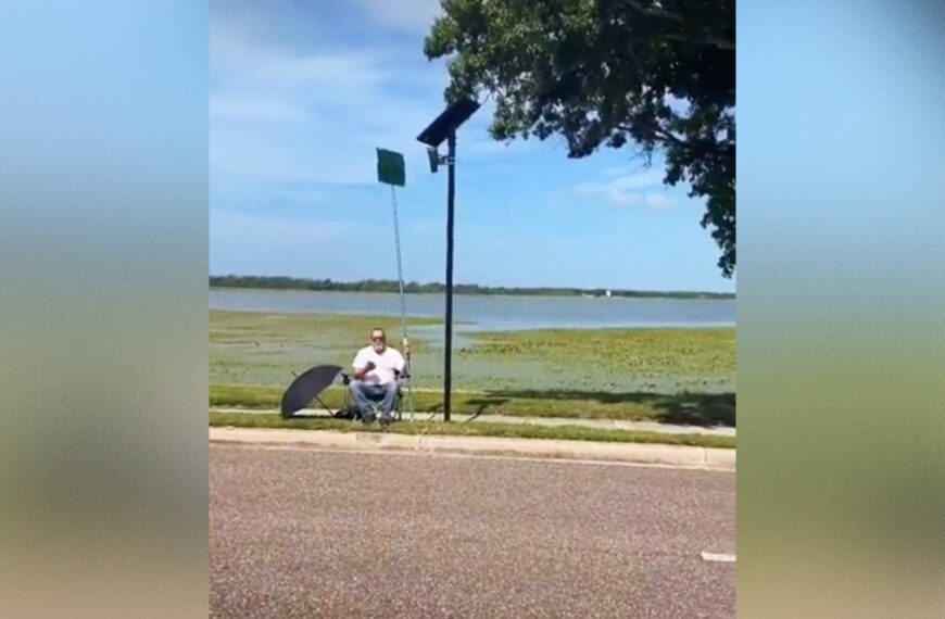 Wild Footage Shows Man Blocking Flock Camera With Comically Gigantic Protest Sign